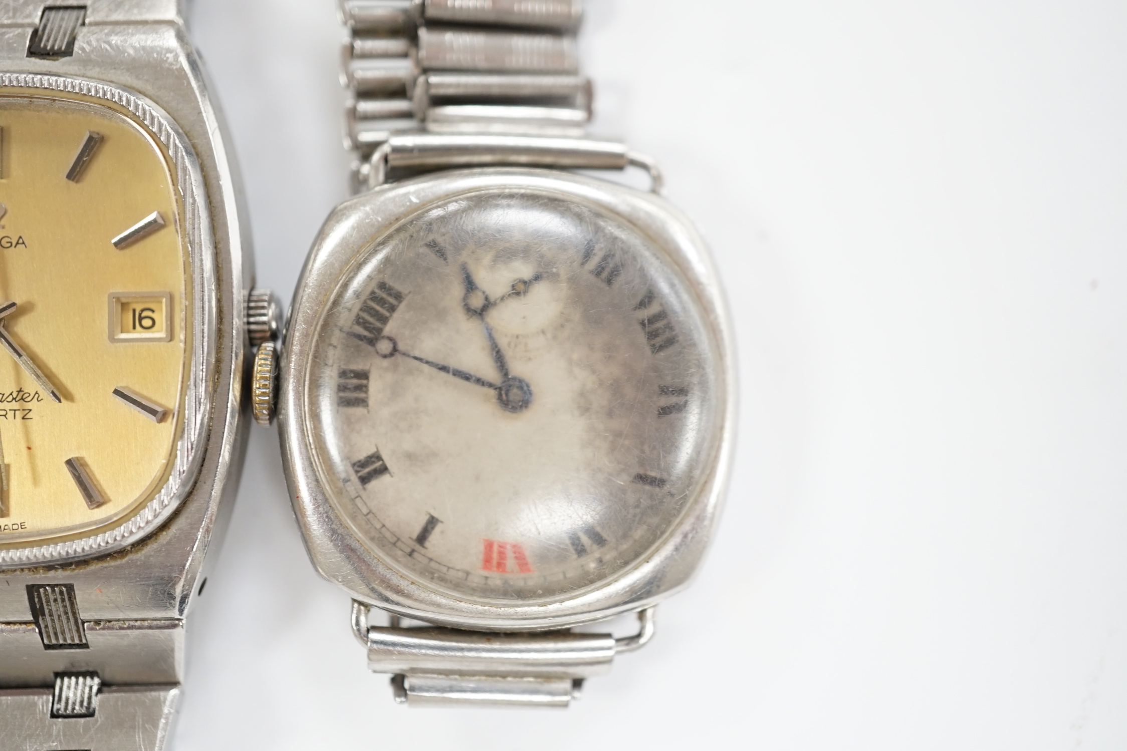 A gentleman's stainless steel Omega Seamaster quartz wrist watch, on Omega bracelet, no box or papers and a gentleman's early 20th century steel Longines manual wind wrist watch.